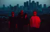 group photo, with city of L.A. in background