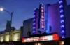 A neon sign on the facade of the venue that reads "Heights"